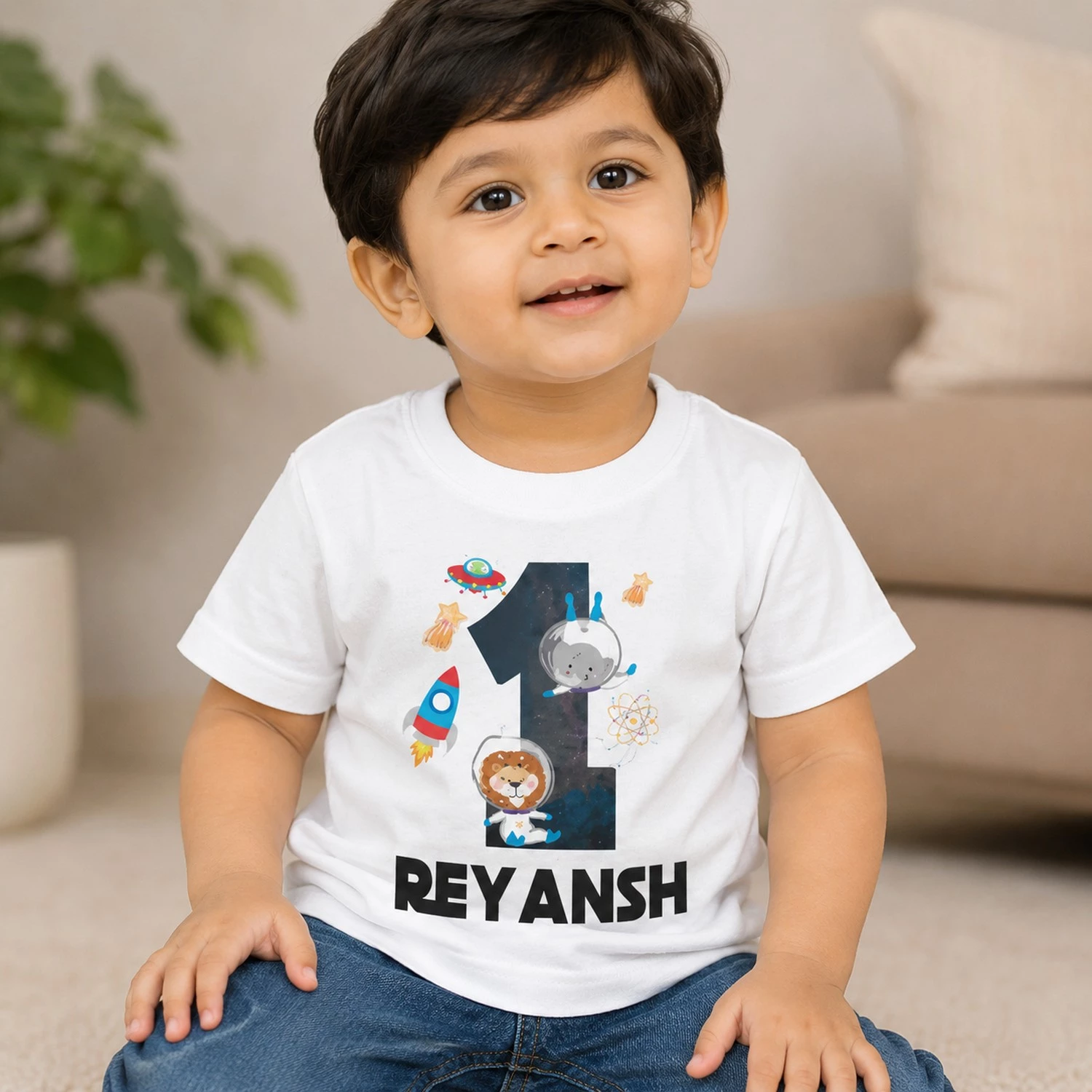 Personalised boys first birthday white T-shirt with number 1 space, rocket and astronaut design and name Reyansh