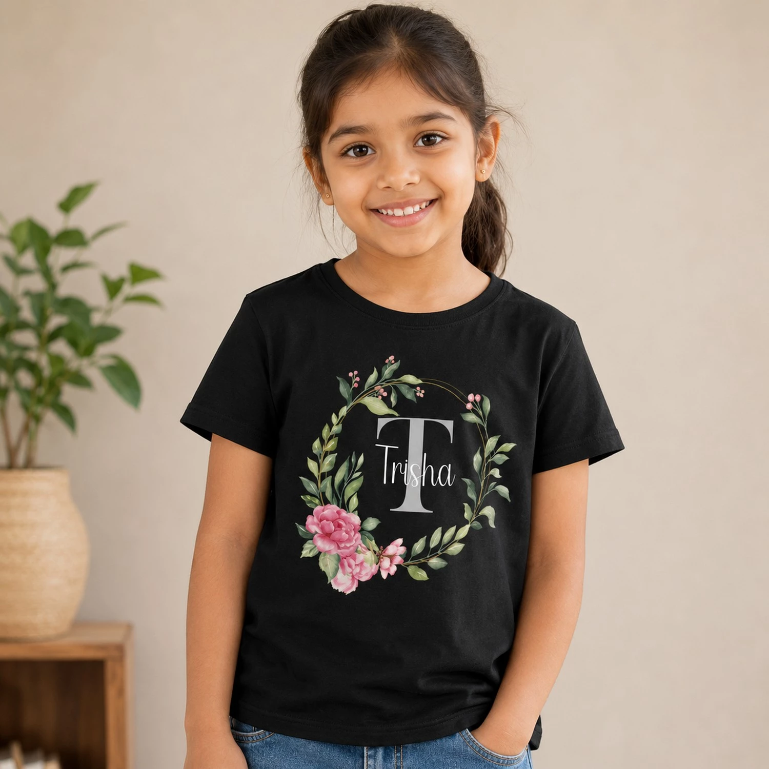 Personalised Trisha girls black T-shirt with floral wreath and initial T