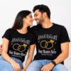 Couple wearing matching black personalized 1st anniversary T-shirts with custom names, wedding date, and ring design, suitable as a husband and wife anniversary gift.
