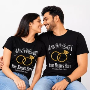 Couple wearing matching black personalized 1st anniversary T-shirts with custom names, wedding date, and ring design, suitable as a husband and wife anniversary gift.