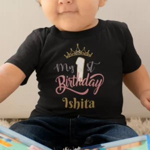 Personalized first birthday baby girl T-shirt with crown design and custom name printed for toddler birthday celebration