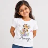 White personalized girls' T-shirt featuring a watercolor giraffe surrounded by pastel flowers and butterflies, with the name Ananya in black cursive lettering.