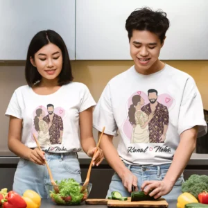 Couple wearing personalized matching T-shirts with caricature illustration and custom names in a kitchen setting