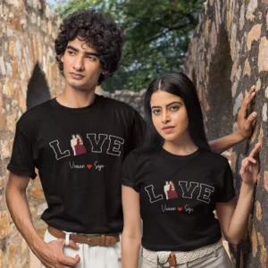 Couple wearing black personalized T-shirts with love typography design and custom names printed, perfect for anniversary or photoshoot