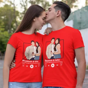 Couple wearing red personalized T-shirts with custom names and music player design in a romantic pose outdoors