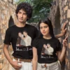 Couple wearing black personalized T-shirts with illustrated selfie design and custom names printed below