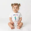 Baby wearing personalized cotton first birthday T shirt with custom name and number 1 design