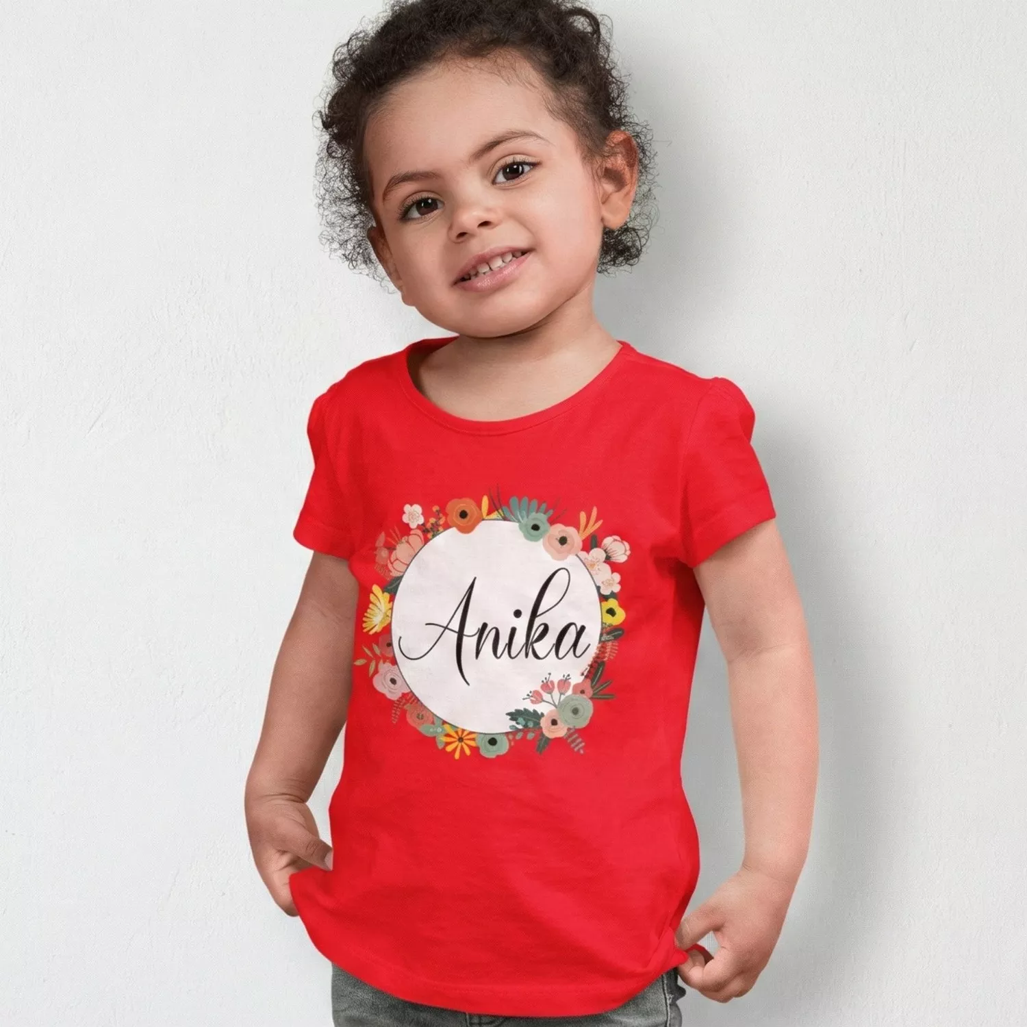 Child wearing red personalized cotton T shirt with floral name print