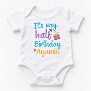 White personalized half birthday baby romper shown in a complete flat lay with colorful “It’s my half Birthday Ayansh” print and snap closure.
