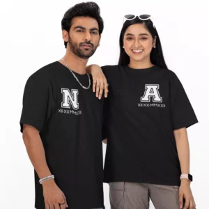 Personalized oversized couple T-shirts with custom initials and Roman numeral date printed on black matching couple tees