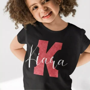 Child wearing black personalized cotton T shirt with large red initial and custom name print