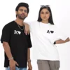 Personalized oversized couple T-shirts with custom initials and heart design matching black and white shirts for couples