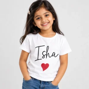 White personalized girls' T-shirt featuring the name Isha in large black handwritten-style lettering with a red heart printed underneath.