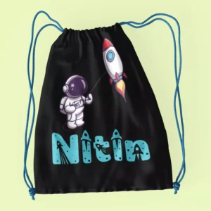 Black cotton drawstring bag with astronaut and rocket design customized with name Nitin