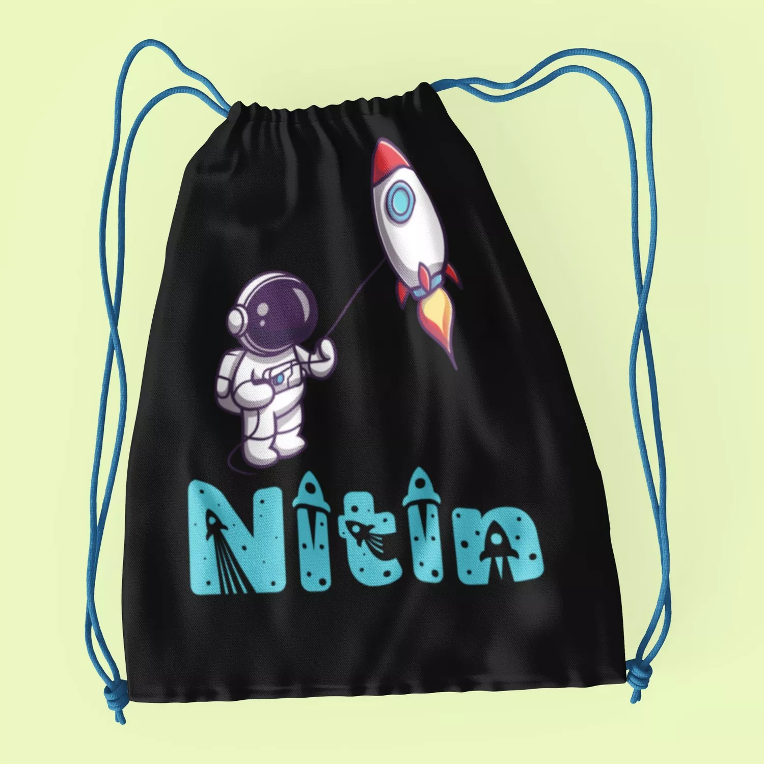 Black cotton drawstring bag with astronaut and rocket design customized with name Nitin