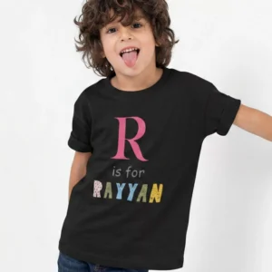 Child wearing black cotton T shirt with personalized initial and name print design
