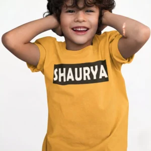 Child wearing mustard cotton T-shirt with custom name print on front