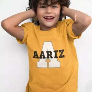 Child wearing mustard yellow personalized cotton T shirt with large initial and custom name print
