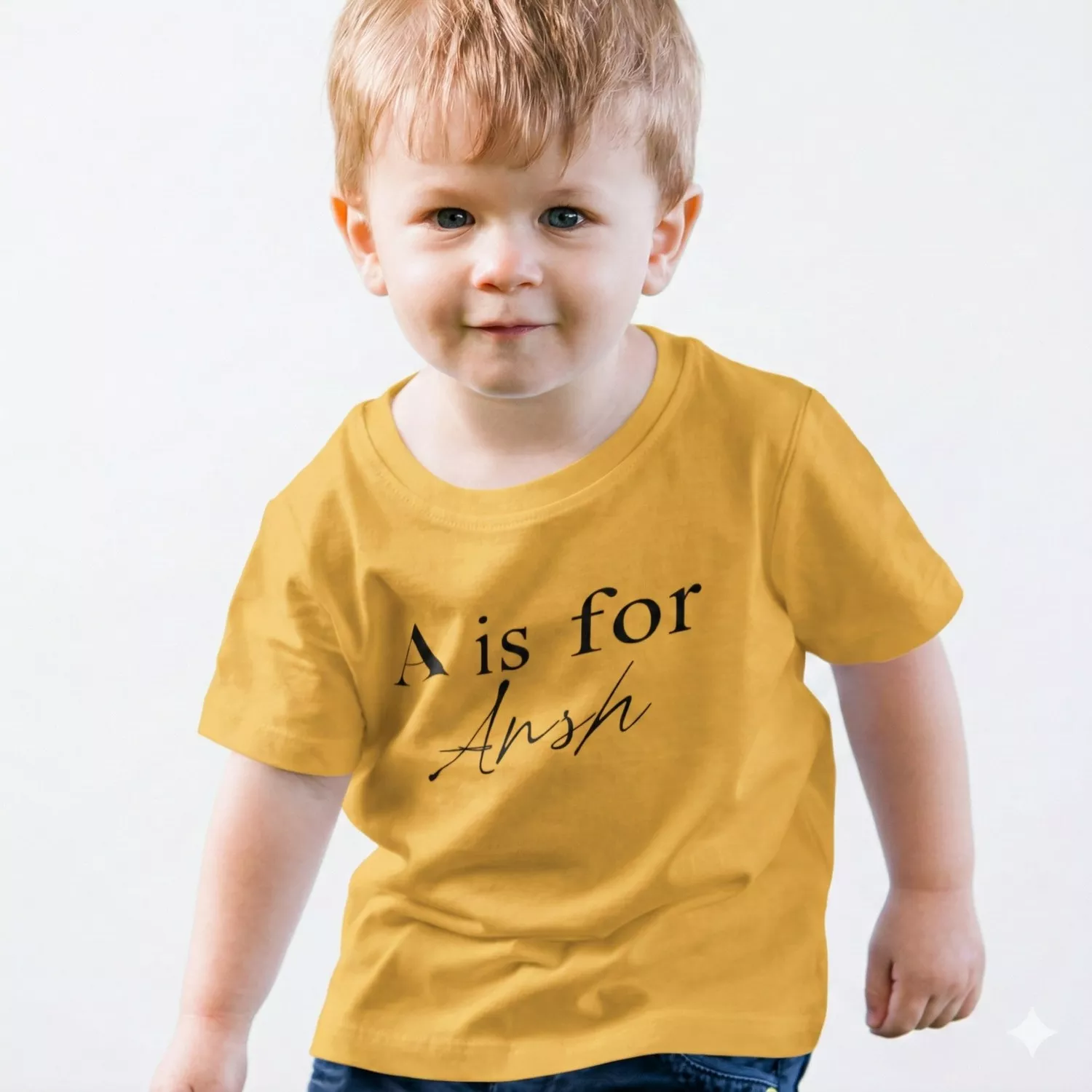 Child wearing yellow personalized cotton T shirt with initial letter and custom name print