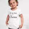 Child wearing white cotton T shirt with personalized initial and custom name print