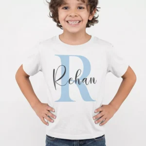 Child wearing personalized cotton T shirt with large initial letter and custom name printed design