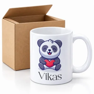 Personalized kids panda coffee mug with the name Vikas displayed beside an open brown packing box.