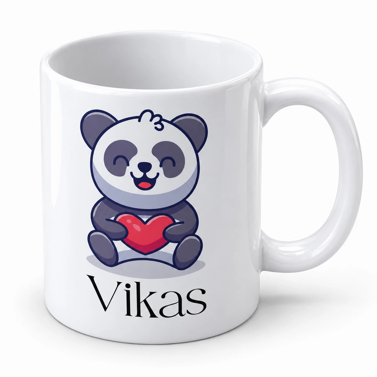 White personalized panda mug for kids with a smiling panda holding a red heart and the custom name Vikas underneath.