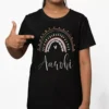 Black 100 percent cotton kids T shirt with pastel rainbow design and custom name Aarohi printed on front
