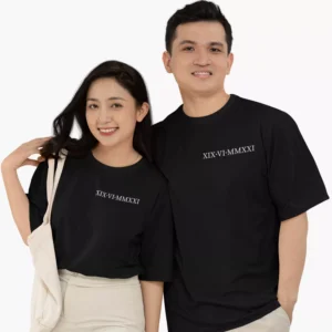 Couple wearing personalized oversized black t shirts with roman numeral anniversary date matching couple outfit
