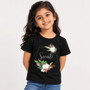 Personalized black girls' T-shirt with the name Swati in white cursive lettering inside a thin gold geometric frame decorated with white flowers and green leaves.