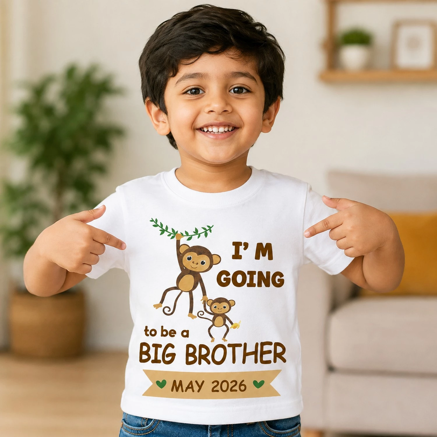 Boy wearing a white big brother announcement T-shirt with cute monkey design holding toys, perfect for pregnancy reveal
