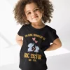 Little girl wearing a black big sister announcement t-shirt with cute elephant design and May 2026 text