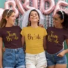Bride wearing yellow Bride T-shirt with friends in matching Team Bride shirts at a bachelorette party celebration