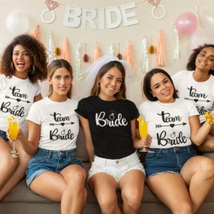 Group of women wearing matching Team Bride t-shirts at a bachelorette party with the bride in the center