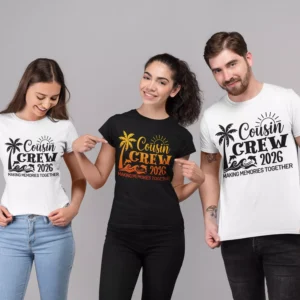 Three people wearing Cousin Crew 2026 matching t-shirts with a beach sunset and palm tree design, ideal for family vacations and group trips