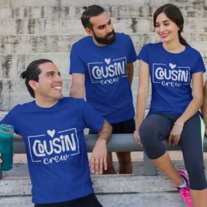 Group of cousins wearing matching blue Cousin Crew t-shirts sitting together during a casual outdoor trip