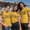 Group of cousins wearing matching yellow Cousin Crew t-shirts at an outdoor court, perfect for family trips and coordinated outfits