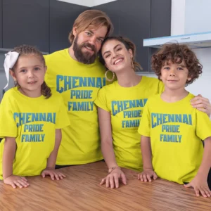 Family of four wearing matching yellow CSK-inspired T-shirts with royal pride typography design for cricket match day