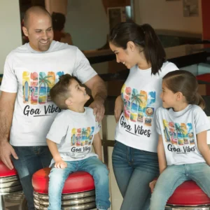 Family of four wearing matching Goa Vibes vacation t-shirts with tropical beach design, perfect for travel and family trips