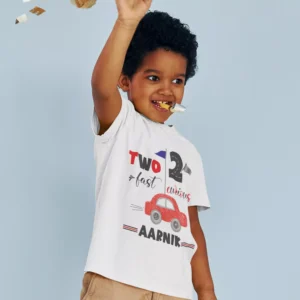Toddler wearing a personalized white T-shirt with “Two Fast Two Curious” car design and custom name for 2nd birthday celebration