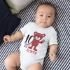 Baby wearing a personalized 10 months old onesie with teddy bear design and custom name printed on it