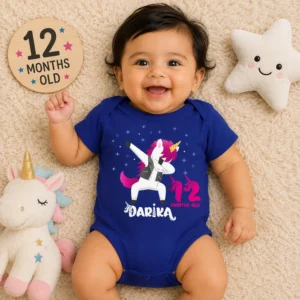 Baby girl wearing a personalized blue unicorn milestone onesie with custom name and 12 months design for photoshoot