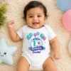 Baby wearing a personalized 1st month birthday onesie with balloon design and custom name, perfect for milestone photoshoot