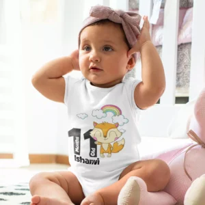 Baby girl wearing a personalized milestone onesie with name and 11 months print featuring a cute fox and rainbow design
