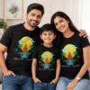 Family wearing personalized black Bali vacation T-shirts with matching tropical temple design and custom August 2026 text