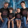 Family of four wearing matching black t-shirts with “Making Memories Together” typography design, ideal for vacations and photoshoots