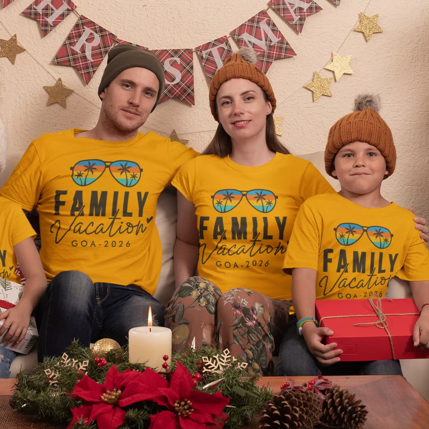 Family wearing matching yellow personalized vacation t-shirts with “Family Vacation Goa 2026” design sitting together during a holiday moment
