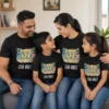 Family of four wearing matching black Goa Vibes 2026 family vacation T-shirts with colorful tropical travel design