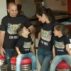 Family of four wearing matching personalized Goa vacation T-shirts with tropical design and 2026 family trip theme
