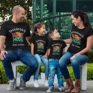 Family wearing personalized vacation mode matching t-shirts with custom name printed, sitting together during a trip